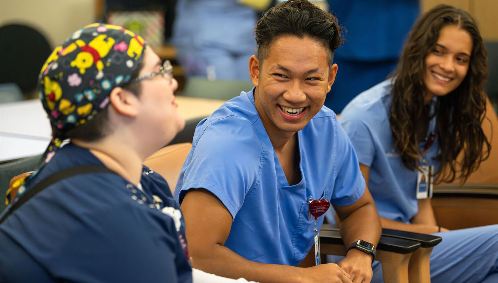 Nursing interns conversing with each other